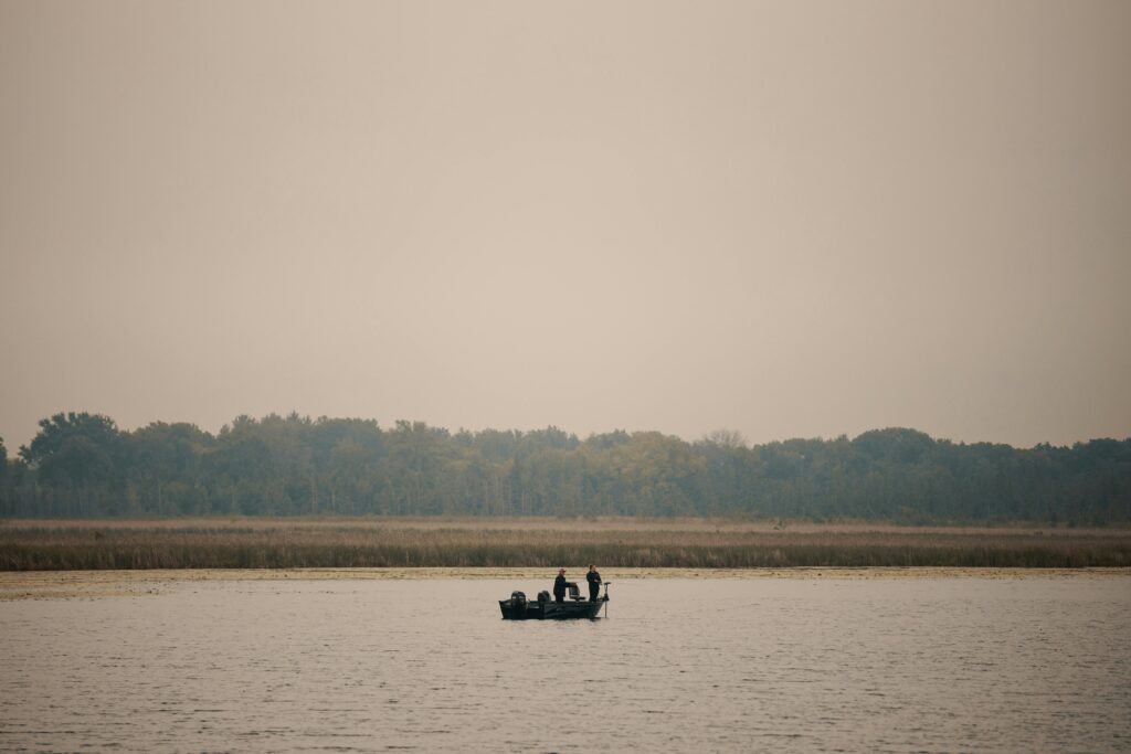 Fishing on a boat at sunset